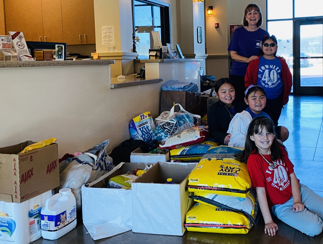 Townley Elementary students and DFWHS volunteer, Pat, show off the results of their Destination Imagination service learning project.